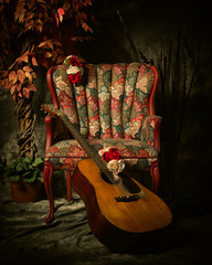 Vintage Acoustic Guitar Leaning Against Antique Chair