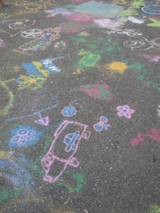 Colored chalks. Colored chalk on playground with drawings on str