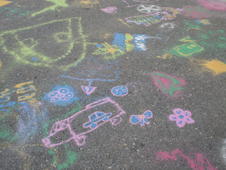 Colored chalks. Colored chalk on playground with drawings on str