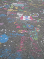 Colored chalks. Colored chalk on playground with drawings on str