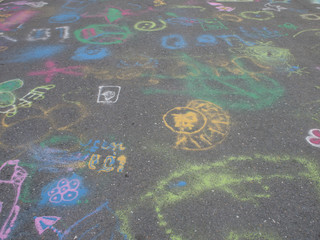Colored chalks. Colored chalk on playground with drawings on str