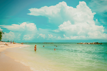 Azure sky turquoise water people swimming in Key West Florida