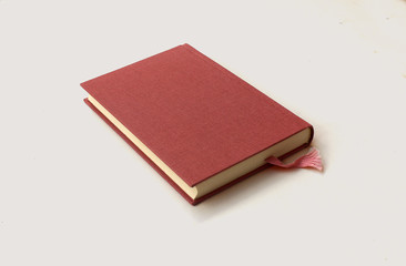 A Book With Light Red Canvas Cover