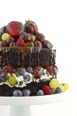 Deliciously divine chocolate cake with berries and cream.