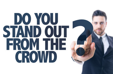 Business man pointing the text: Do You Stand Out from the Crowd?