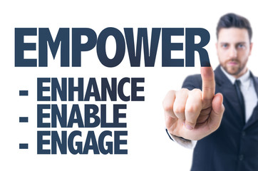 Business man pointing the text: Empower