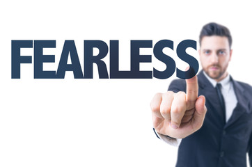 Business man pointing the text: Fearless
