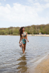 Naklejka premium young indian woman in the lake