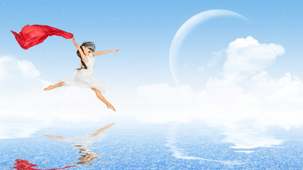 Dancing girl in dress on water surface