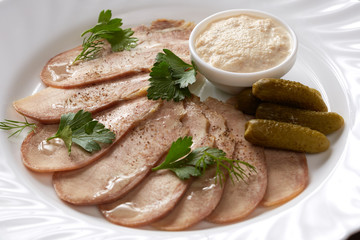 Cold meats, pickles and sauce. Restaurant food