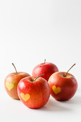 Red apples with a heart symbol
