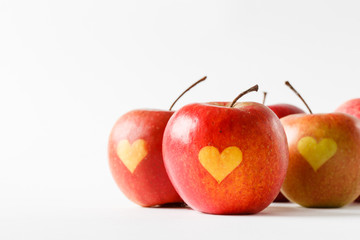 Red apples with a heart symbol