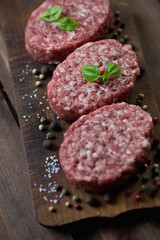 Raw beef cutlets with various spices