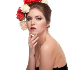 Fototapeta na wymiar Beautiful girl with red lips and flowers in head