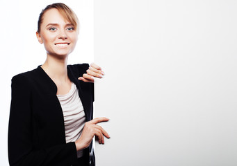  young business woman showing blank signboard