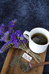 tea cup on wooden board