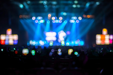 Fototapeta na wymiar Blurred background : Bokeh lighting in concert with audience ,Mu