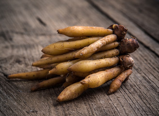 Fingerroot herb on wood background
