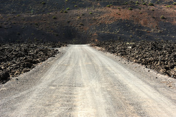 a road on volcanic landscape at  Lanzarote Island, Canary Island