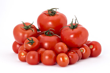 Ripe cherry tomatoes and tomatoes wattled on white background