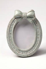 Ornate oval shape picture frame on white background