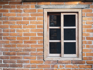 Brick wall with wooden window