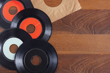 Record vinyl top view on wooden background