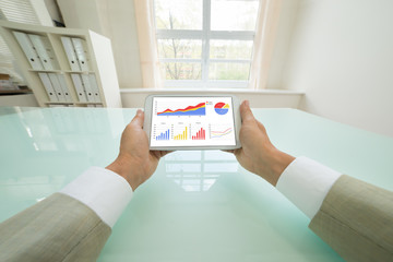 Businessman Analyzing Graph On Digital Tablet