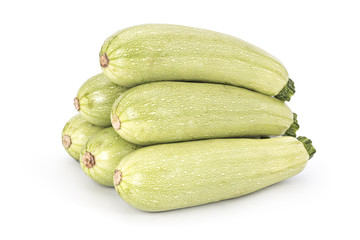 Young fresh courgettes (zucchini) isolated on white