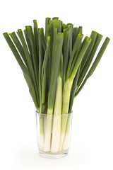 Young spring green onion in glass isolated on white background - 82590733