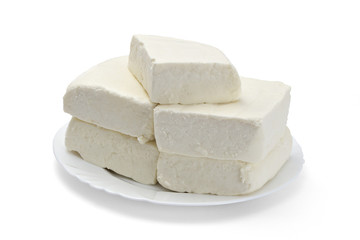 Fresh cheese from cow's milk on white background