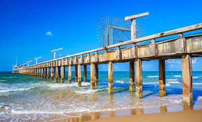 Old cement broken pier at the sea.