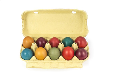 Easter eggs in cardboard egg box on white background