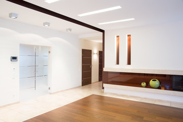Bright corridor with fireplace