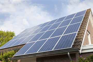 House Roof Covered With Solar Panels