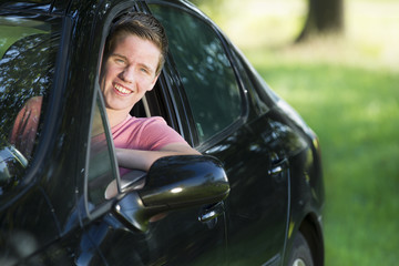 Man Driving Car While Looking Out Through Window