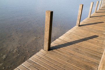 Fototapeta premium Wooden bridge on the seashore