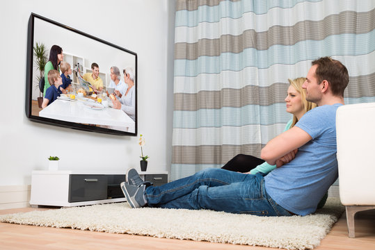 Couple Watching Television In Living Room