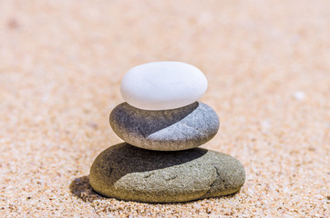 Fototapeta na wymiar stones in the sand on the beach
