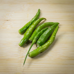 Green peppers  on wooden table