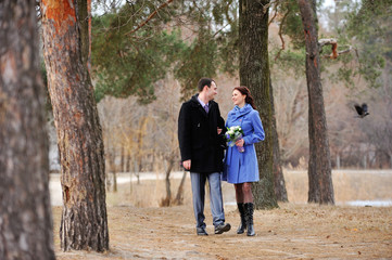 Young couple walking in the forest