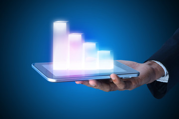 businessman showing digital graph