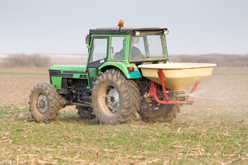 Tractor fertilizing field