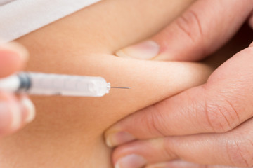 Patient Making Insulin Shot By Use Of Syringe