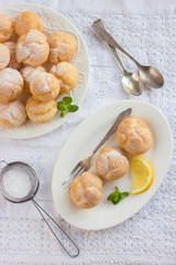 profiteroles with cream and powdered sugar