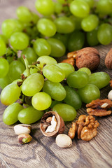 Assorted nuts with grapes.
