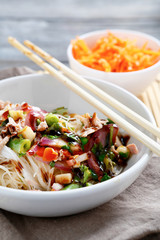 Noodles with tuna in a white bowl