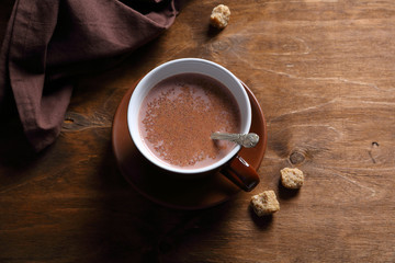 Tasty cocoa in a black cup