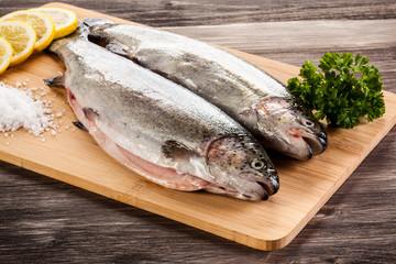 Fresh raw trouts on cutting board