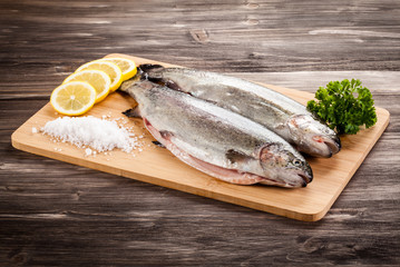 Fresh raw trouts on cutting board